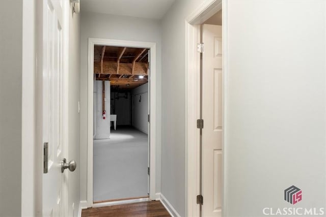 hall with dark wood-type flooring