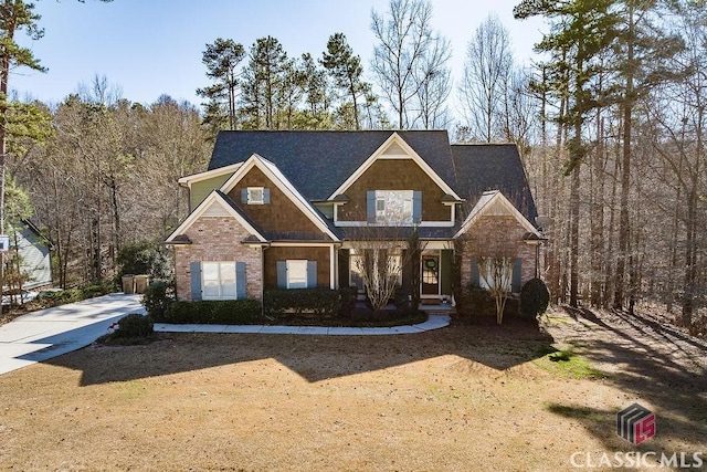 craftsman house featuring brick siding