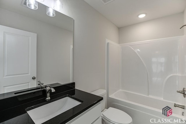 bathroom with shower / bath combination, vanity, and toilet