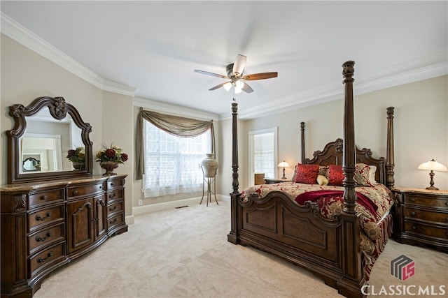 bedroom with light carpet, visible vents, baseboards, a ceiling fan, and crown molding