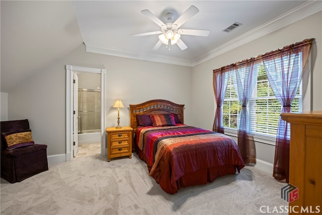 carpeted bedroom featuring visible vents, crown molding, ensuite bath, and baseboards