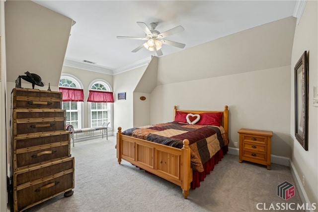 carpeted bedroom featuring visible vents, baseboards, lofted ceiling, ceiling fan, and crown molding