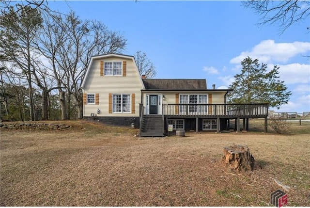 view of front of property featuring a deck and a gambrel roof