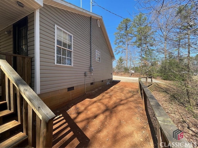 view of side of property featuring crawl space