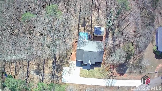 aerial view with a wooded view