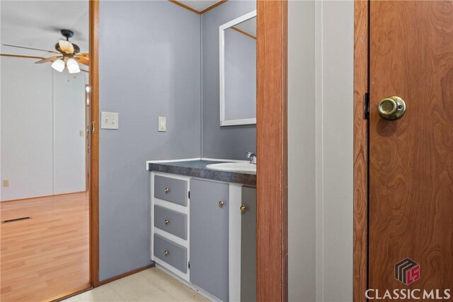 bathroom featuring visible vents, vanity, and ceiling fan