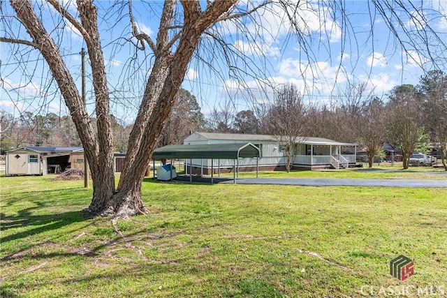 exterior space with a carport and driveway