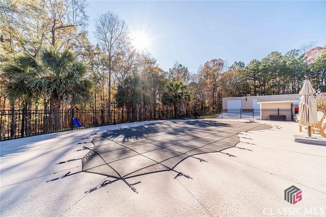 view of pool featuring fence