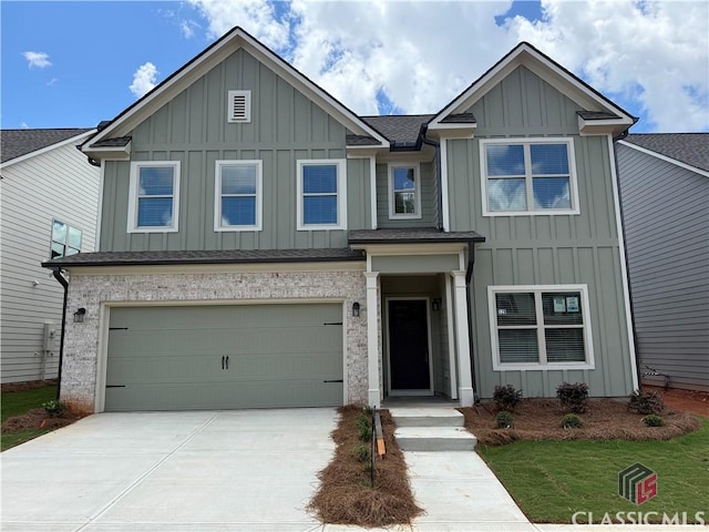 329 Ridge Pointe Dr, Athens, GA 30606 - view of front facade featuring board and batten siding, driveway, a garage, and roof with shingles
