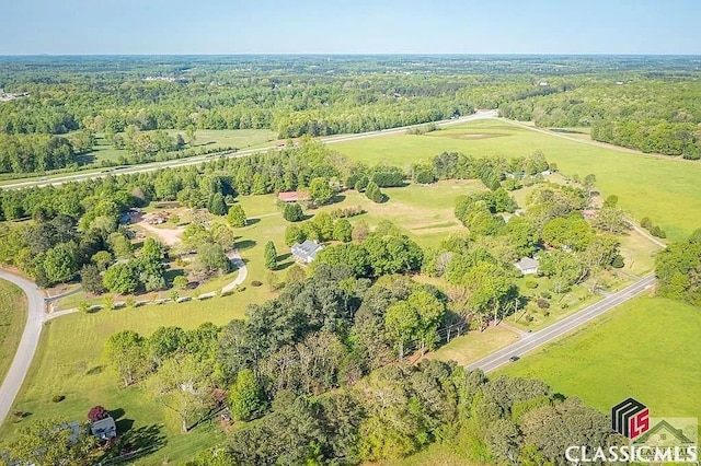 aerial view featuring a rural view and a view of trees