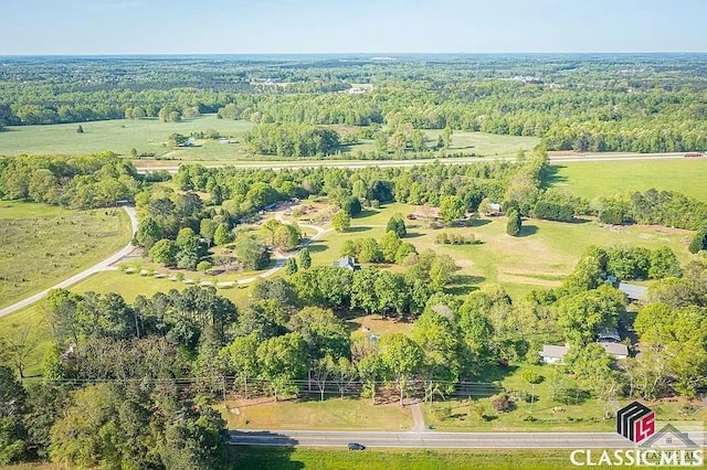 bird's eye view featuring a wooded view