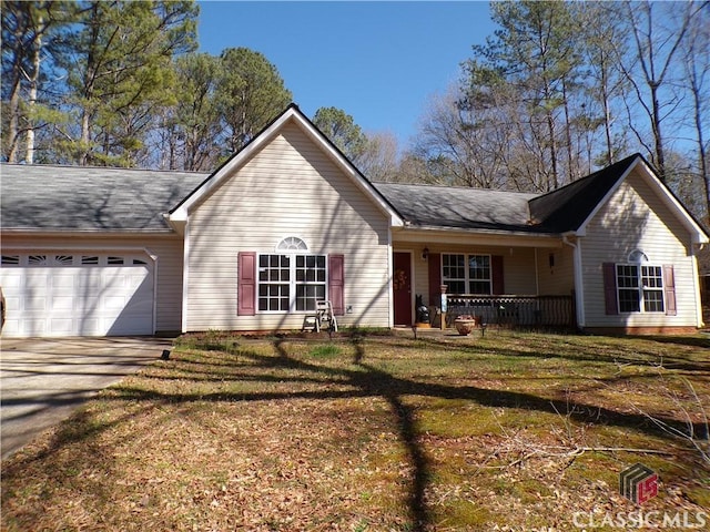 ranch-style home featuring driveway, a front lawn, covered porch, and an attached garage