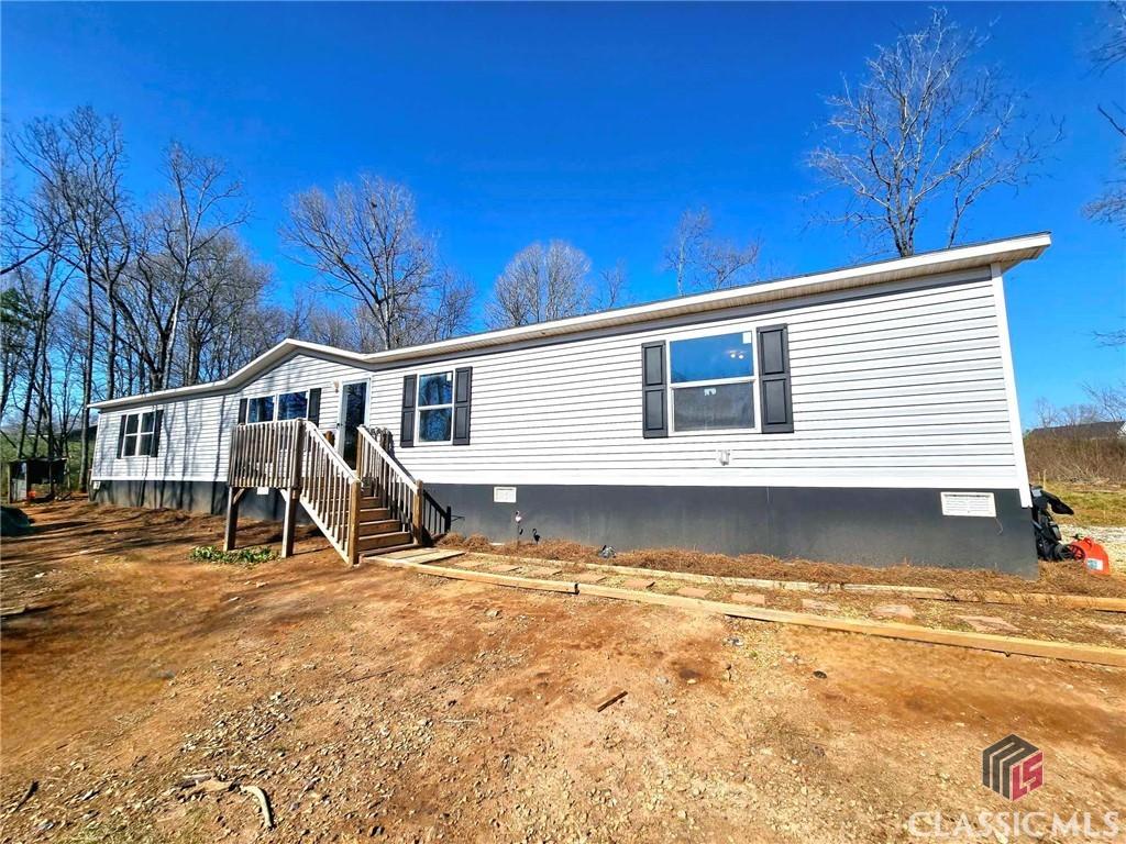 manufactured / mobile home featuring stairs and crawl space