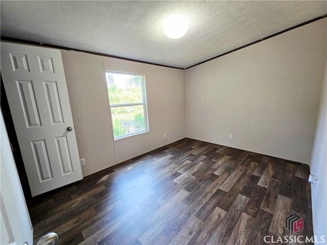 305 Langford Carey Rd, Danielsville, GA 30633 - spare room featuring a textured ceiling and dark wood finished floors