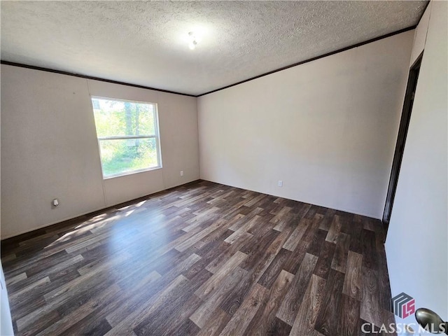 305 Langford Carey Rd, Danielsville, GA 30633 - unfurnished room featuring dark wood finished floors, a textured ceiling, and crown molding