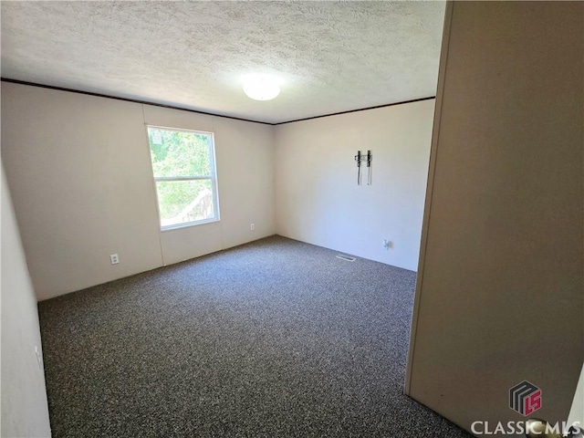 305 Langford Carey Rd, Danielsville, GA 30633 - carpeted spare room with a textured ceiling