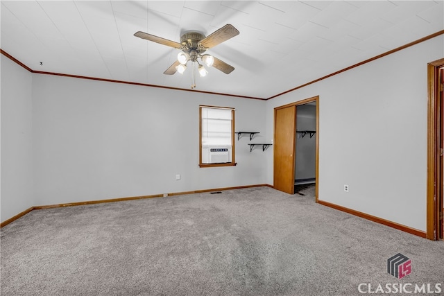 interior space featuring crown molding, carpet, baseboards, and ceiling fan