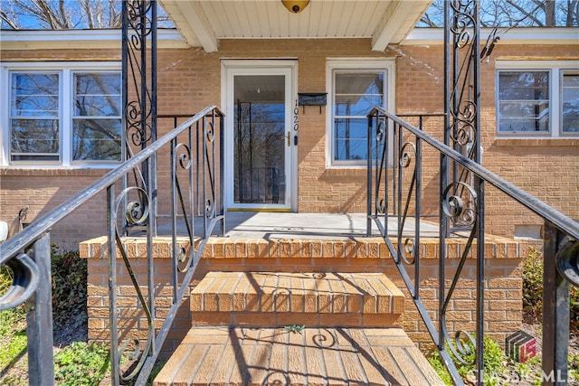 entrance to property with brick siding