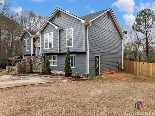 view of property exterior featuring fence