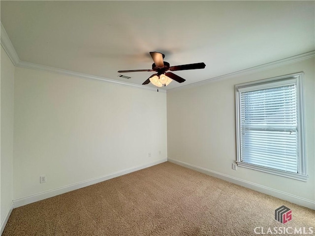 unfurnished room featuring visible vents, light colored carpet, baseboards, and ornamental molding