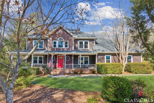 view of front of property with a front yard and covered porch