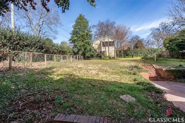 view of yard with a fenced backyard