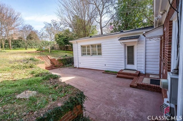 view of patio featuring fence