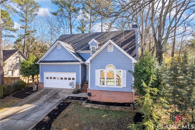 view of front of home with brick siding, fence, concrete driveway, a chimney, and an attached garage