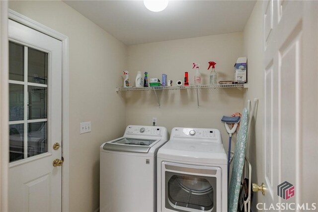 laundry room with washing machine and dryer and laundry area