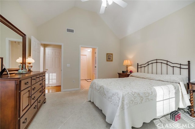 bedroom featuring visible vents, light carpet, high vaulted ceiling, baseboards, and ceiling fan