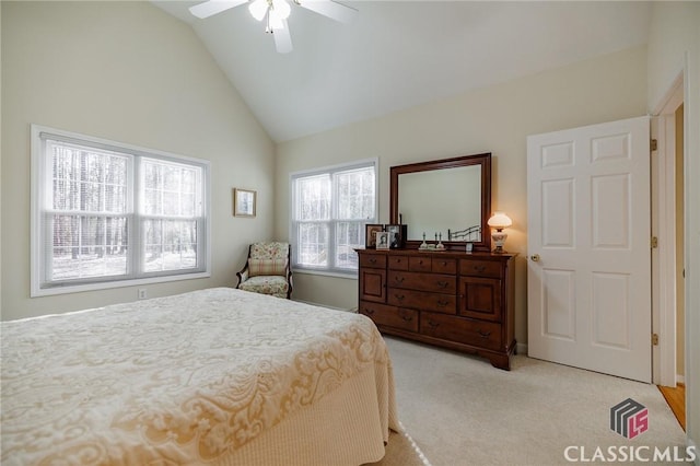 bedroom featuring light colored carpet, lofted ceiling, and ceiling fan