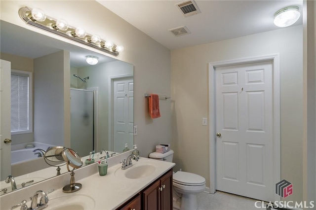 full bathroom with a sink, visible vents, a stall shower, and double vanity