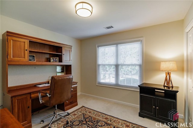 office with visible vents, light carpet, and baseboards