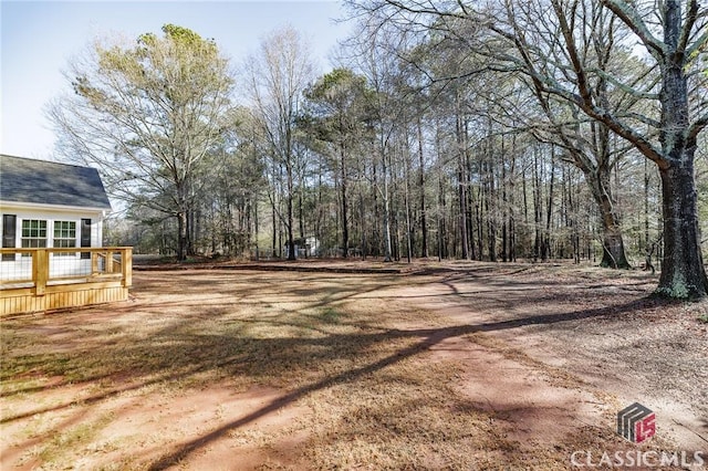 view of yard with a wooden deck