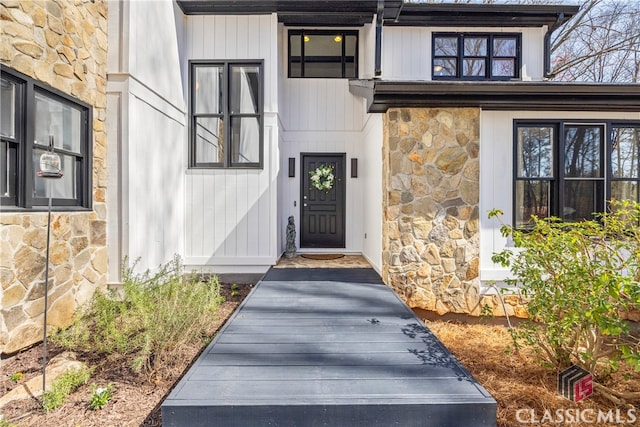 entrance to property with stone siding