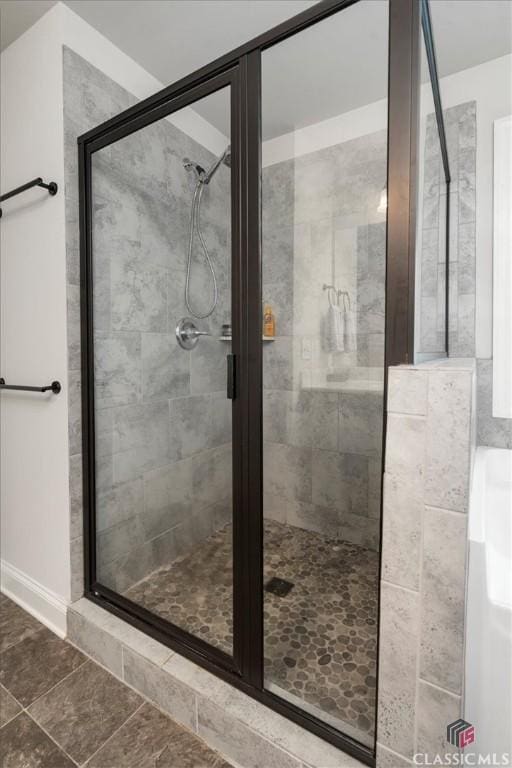 full bathroom with a shower stall