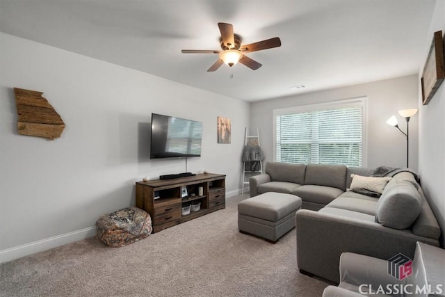 carpeted living room with baseboards and ceiling fan
