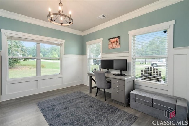 home office featuring crown molding, a notable chandelier, wood finished floors, and visible vents