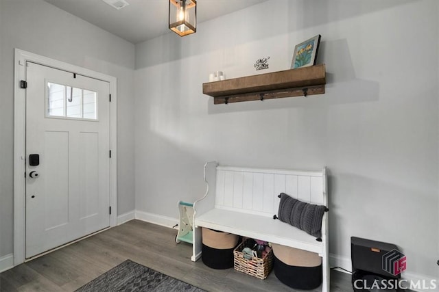entrance foyer with baseboards and wood finished floors