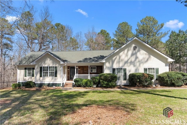 single story home with a porch, a shingled roof, and a front lawn