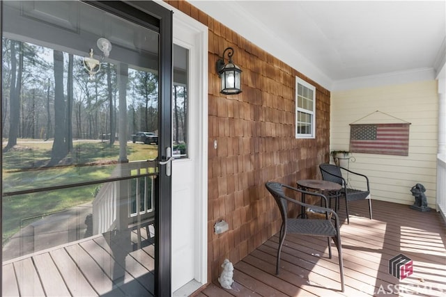 wooden deck featuring covered porch