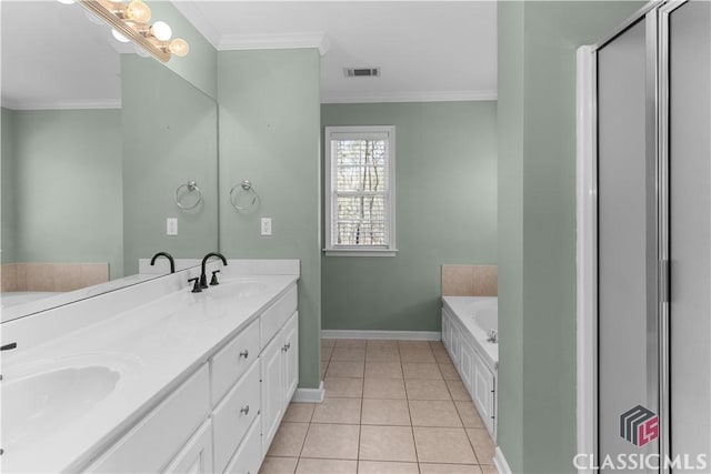 bathroom with tile patterned floors, ornamental molding, visible vents, and a sink