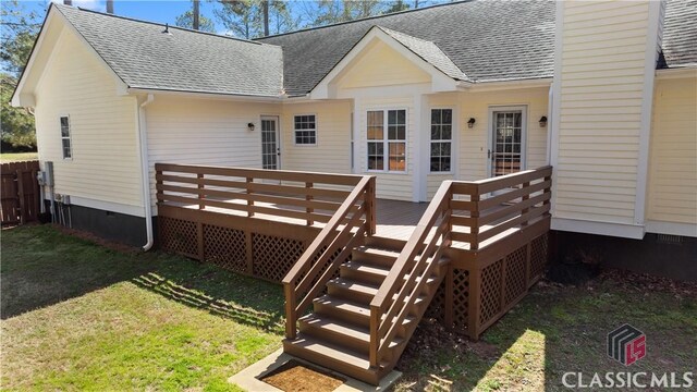 back of house with crawl space, a yard, roof with shingles, and a deck