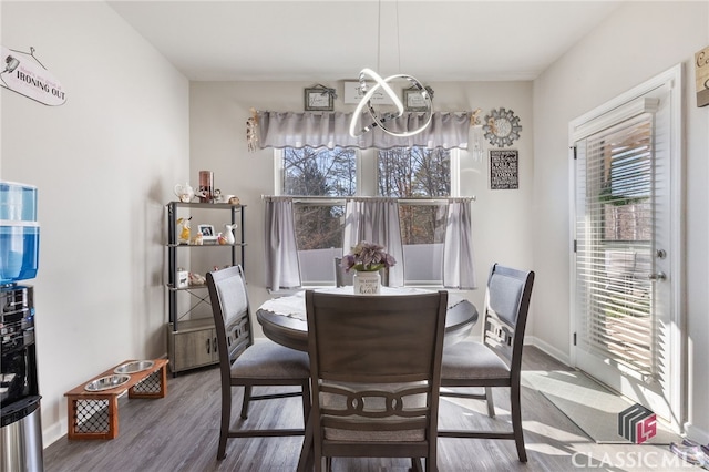 dining area featuring wood finished floors and a wealth of natural light