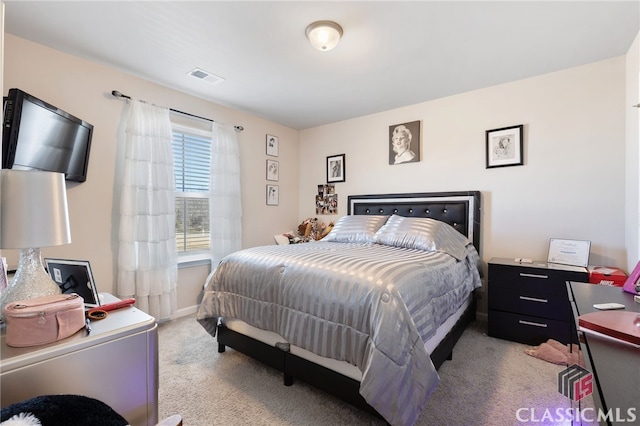 bedroom with baseboards, visible vents, and carpet floors