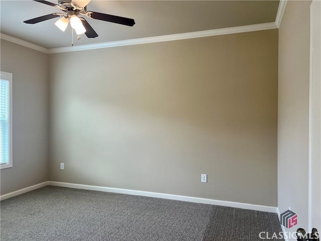 spare room with baseboards, carpet flooring, and crown molding