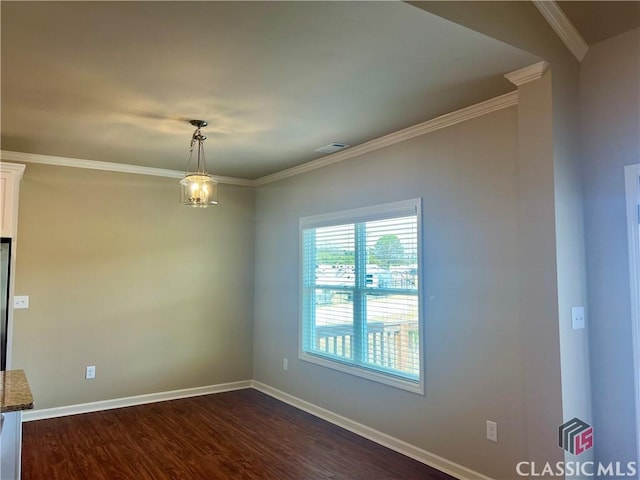 unfurnished room with dark wood finished floors, crown molding, baseboards, and visible vents