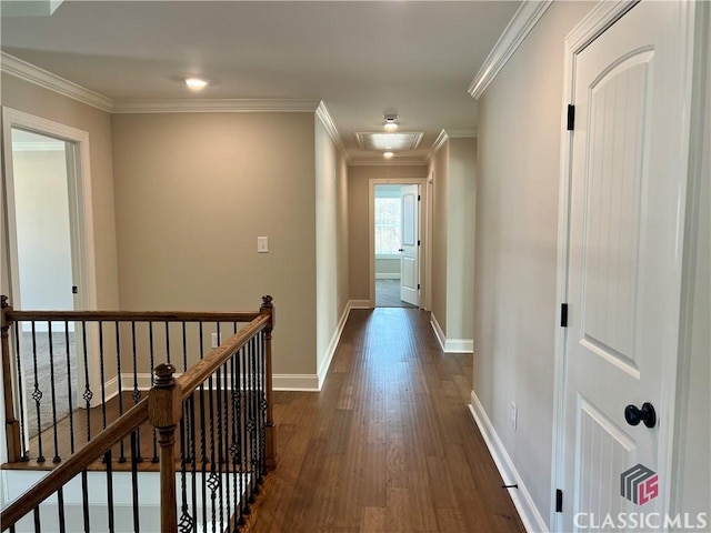 hallway with an upstairs landing, dark wood finished floors, crown molding, and baseboards