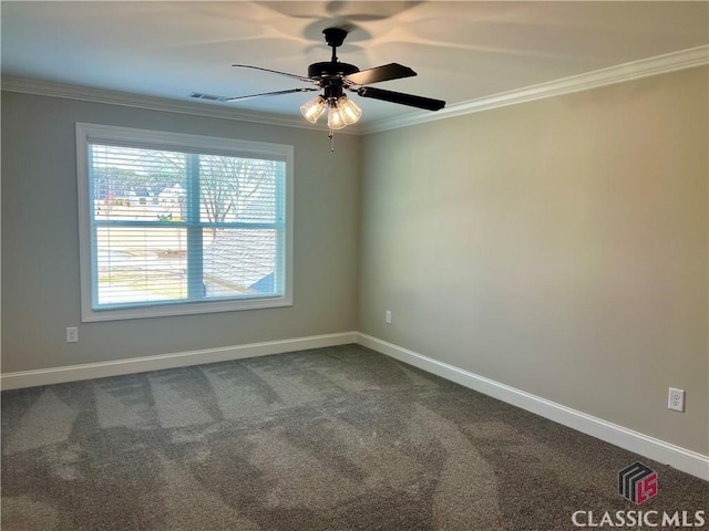 empty room with baseboards, carpet floors, ornamental molding, and a ceiling fan