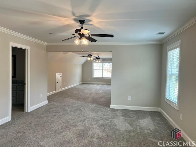 interior space featuring visible vents, carpet floors, ceiling fan, and crown molding